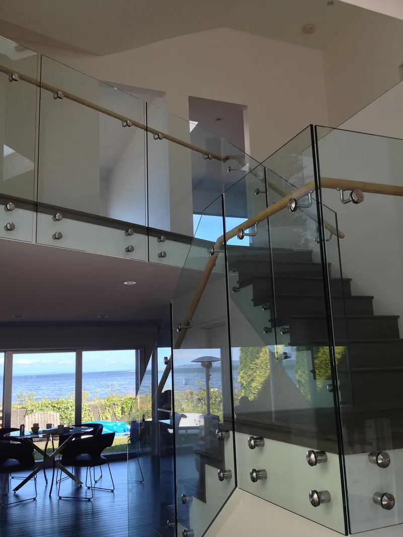 Outdoor deck glass railing with ocean view in Lower Mainland